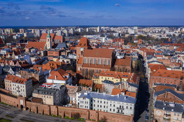 Fototapeta na wymiar Drone view with St John the Baptist Cathedral and Church of Holy Spirit in historic part of Torun city in Poland