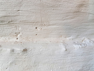 Textured rough surface of the wall after the whitewash