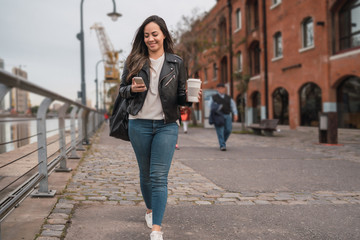 Young woman using her phone.