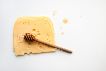 top view of radamer cheese isolated on white. Sliced ​​Cheese. Maasdam is a hard Dutch cheese...