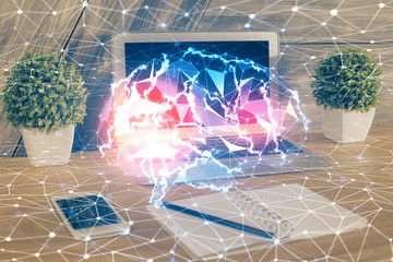 Multi exposure of work table with computer and brain hologram. Brainstorm concept.