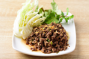 Traditional Northern Thai food, spicy minced pork salad (Larb Moo Kua)