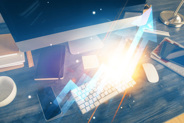 Computer on desktop with point up arrows hologram. Double exposure. Concept of success.