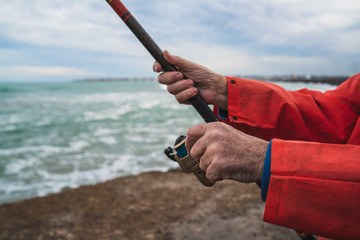 Fisherman fishing at the sea.