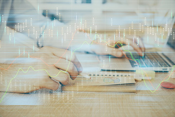 Multi exposure of financial graph with man works in office on background. Concept of analysis.