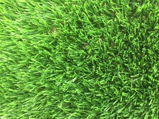 An above view of close up of fake grass showing the many plastic grass stems
