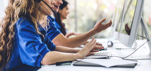 Group of call center happy smiling business operator customer support team phone services working...