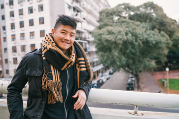 Obraz premium Portrait of young Asian man outdoors.