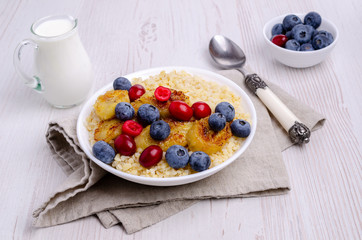 Wheat porridge with fruit and berries