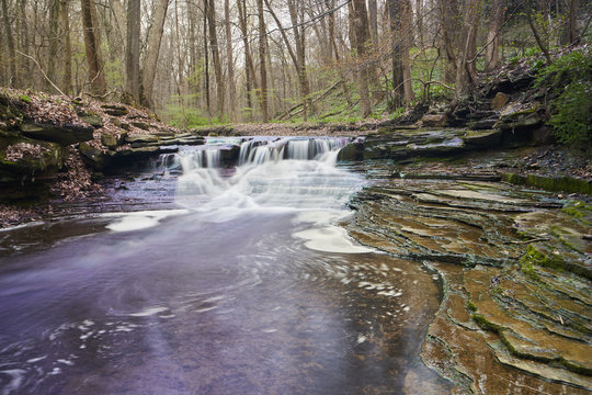 A waterfall at South Chagrin metropark on a day in spring.