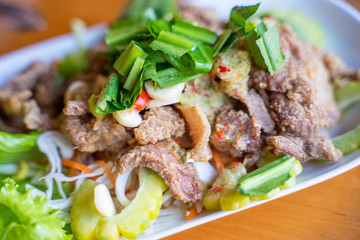 Yum Moo Tod-spicy salad with fried pork