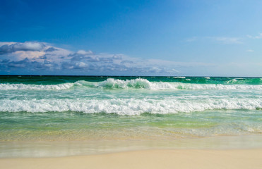 Turquoise waves rolling into shore