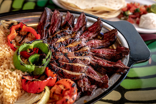 Hot platter of steak fajitas and sides