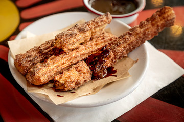 Cinnamon and sugar fried churros with chocolate