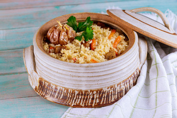 Pilaf with meat, carrot and garlic.