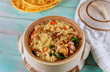 Arabic dish with rice, meat, carrot and pita bread.
