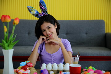 Asia young girls are painting paint on Easter eggs.
