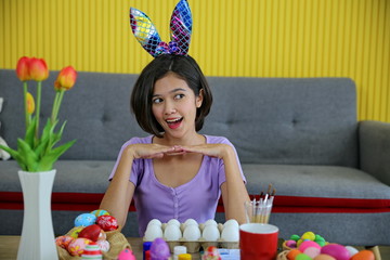 Asia young girls are painting paint on Easter eggs.