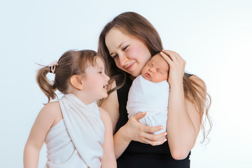 the concept of a healthy lifestyle, the protection of children, shopping - baby in the arms of the mother and father. Woman and man holding a child. Isolated on white background. Copy space