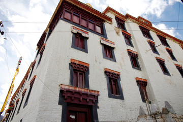 Buddhist old monastery with traditional tibetan decorations, wooden windows. Ladakh, Tibet region....