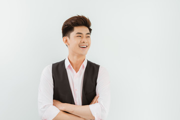 Portrait of confident modern young Asian man on white background