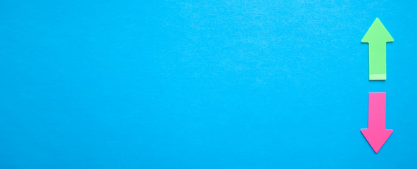 Up and down arrows on blue background.