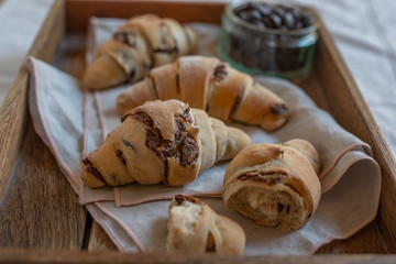 home made croissant filled with chocolate on a plate