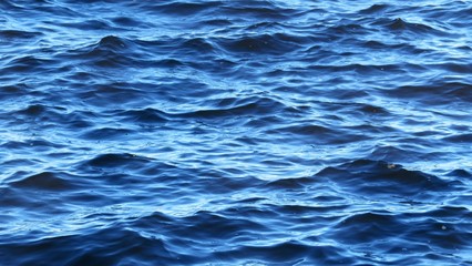 Waves on blue river water surface,  natural background 