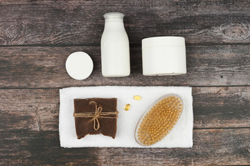 Various body care and spa products isolated on blue background. Spa composition, top view. White empty cosmetic tubes with a copy space