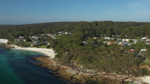 Aerial view of the town of Huskisson along the beautiful waters of Hyams Beach known for its vibrant white sand, at Jervis Bay on the New South Wales South Coast, Australia, on a sunny day 