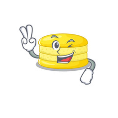 mascot of funny lemon macaron cartoon Character with two fingers
