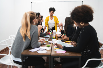Manager woman leading a brainstorming meeting.