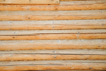 wall composed of processed logs, log house texture