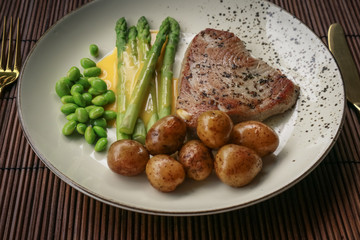 Grilled tuna steak served with asparagus