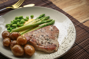 Grilled tuna steak served with asparagus