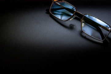 Photo of glasses in a case with space for text