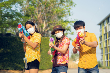 Asian people wear masks to protect against viruses. In the Songkran festival in Thailand in April