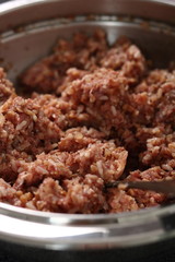 Making stuffing from minced meat and rice. Making Stuffed Peppers Series.