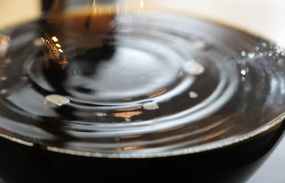 Image of coffee dripping in glass jar © Sapiens
