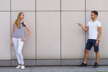 Man point finger at girl.