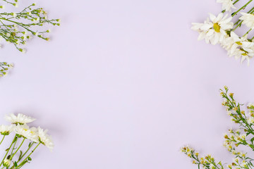 wild flowers and copy space over purple background