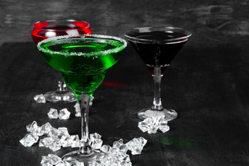 Beautiful alciohol cocktail on dark stone table