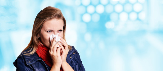 Allergy young woman with couch. Infection sad female hod handkerchief.