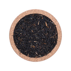 Fototapeta premium Loose tea Isolated on a white background. On coasters made of cork. Assortment concept for a tea shop, teahouse. Tea collection.