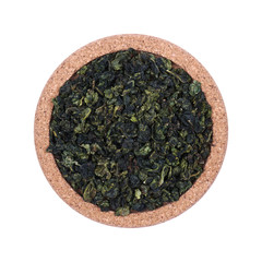 Loose tea Isolated on a white background. On coasters made of cork. Assortment concept for a tea shop, teahouse. Tea collection.