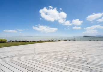 Outdoor viewing platform and lake landscape under the blue sky