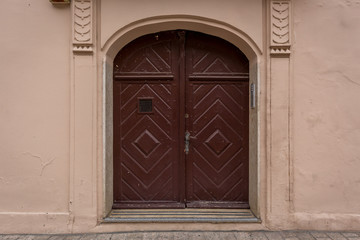 Wall background of old buildings with wooden door and windows