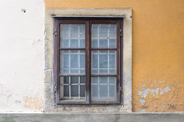 Fototapeta na wymiar Brick walls background of ancient buildings with windows