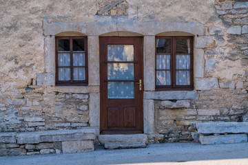 Wall background of old buildings with wooden door and windows