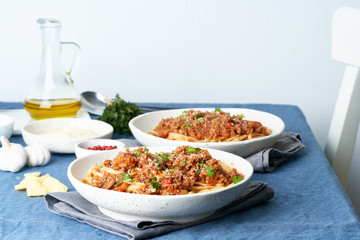 Pasta Bolognese Linguine with mincemeat and tomatoes. Italian dinner for two